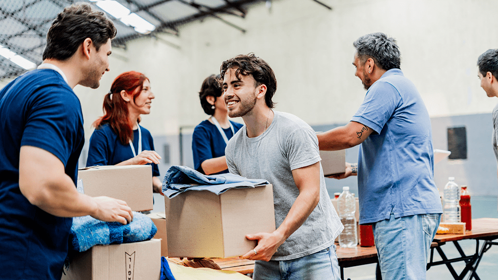 Volunteers organizing donations in a warehouse