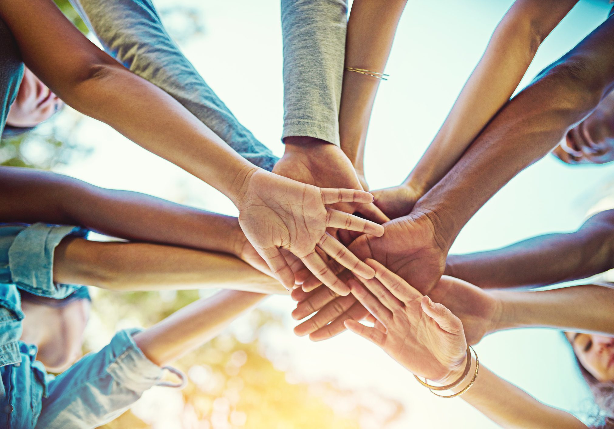Cropped shot of a group of friends with their hands piled on top of each other